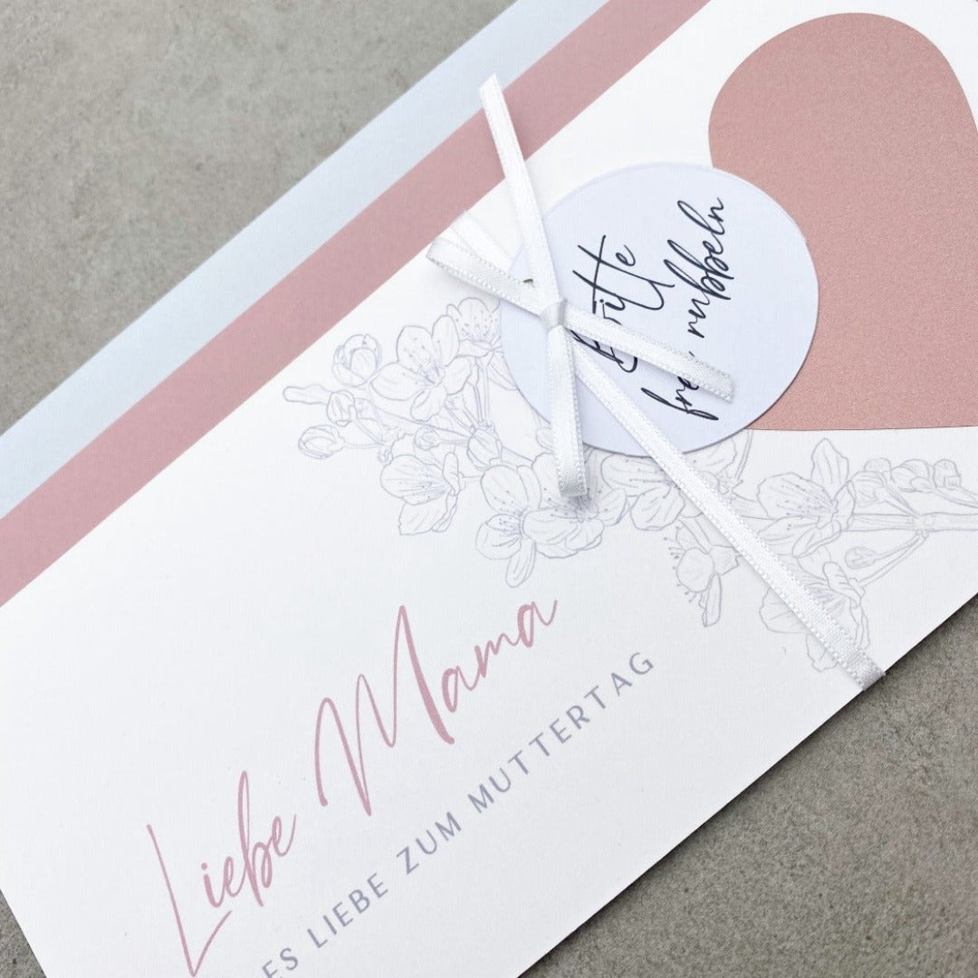 Rubbelgutschein als rosa Herz mit Kirschblüten