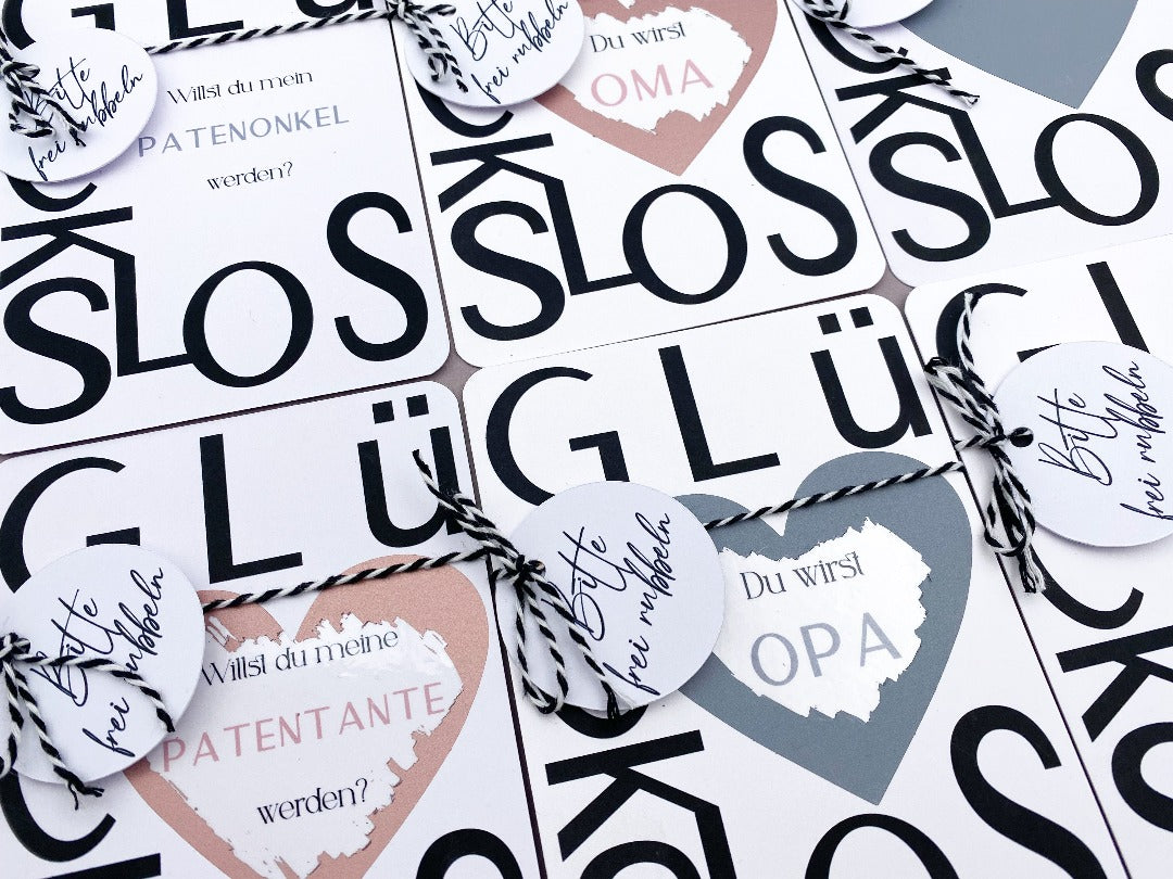 Glückslos um der Familie die Schwangerschaft zu verkünden, mit farbigem Rubbelherz