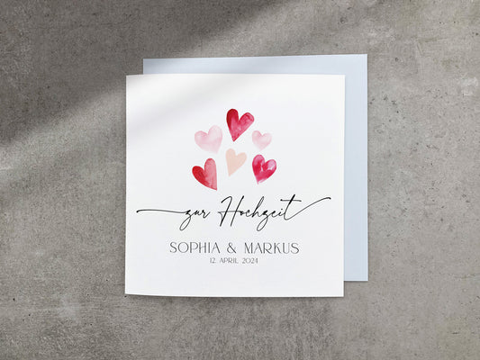 Moderne Karte zur Hochzeit mit rosa und roten Aquarell Herzen