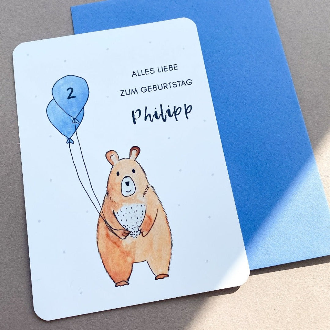 Glückwunschkarte zum Geburtstag mit Bär und Luftballons in blau